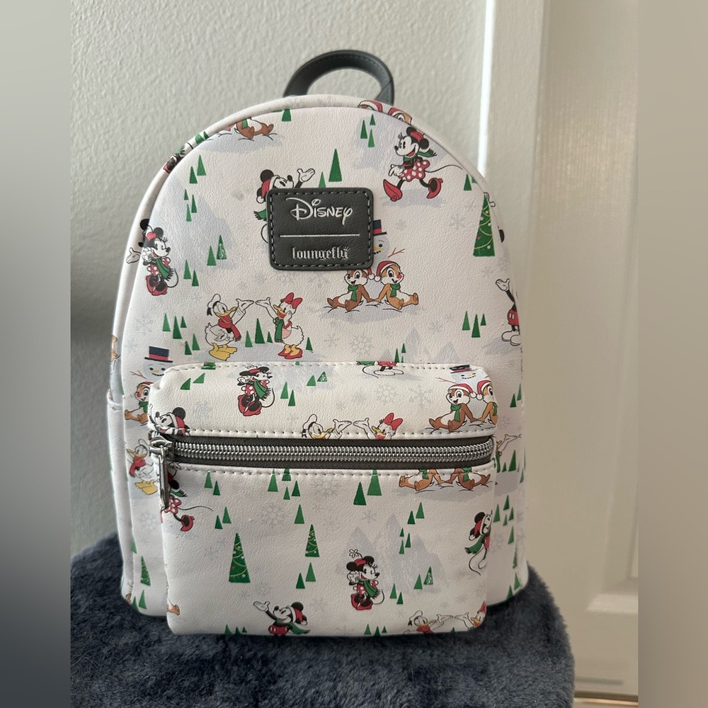Christmas Theme Mickey and friend’s Loungefly backpack. Brand new with tags.